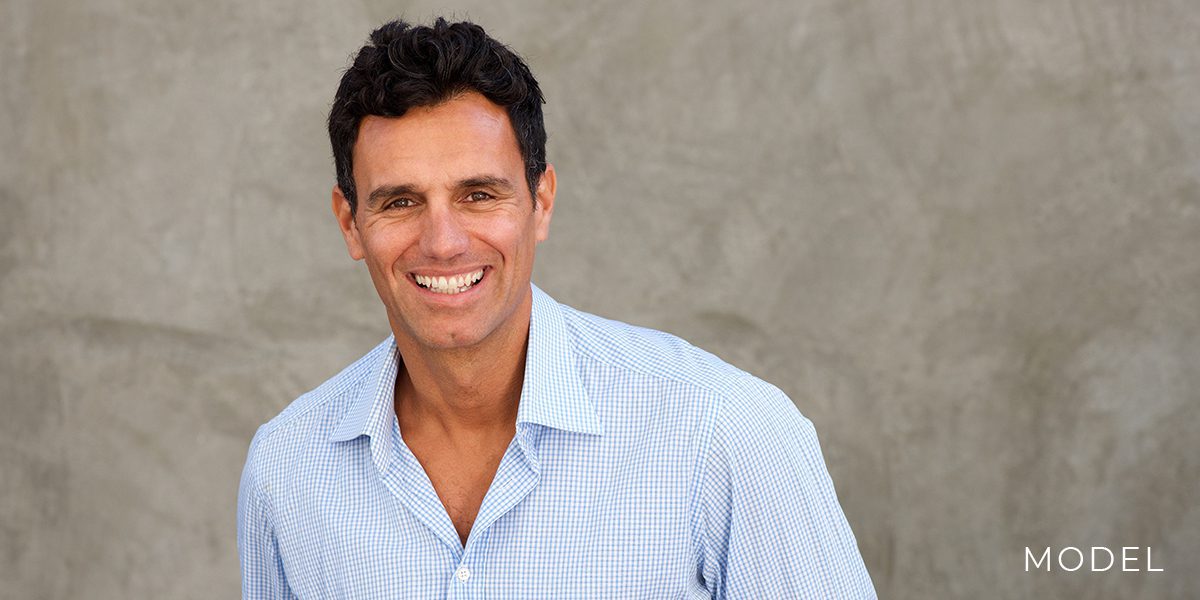 Male model in a blue shirt for Dental Implants