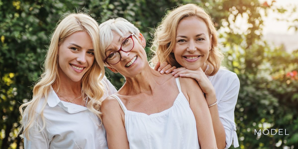 Three female models in white for dental implants. 